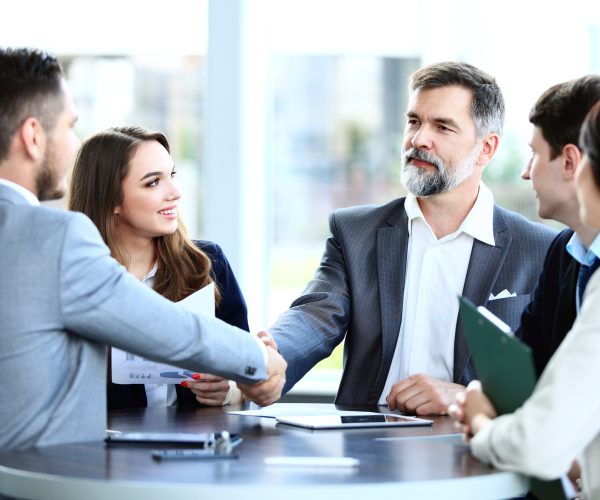 Business people shaking hands, finishing up a meeting